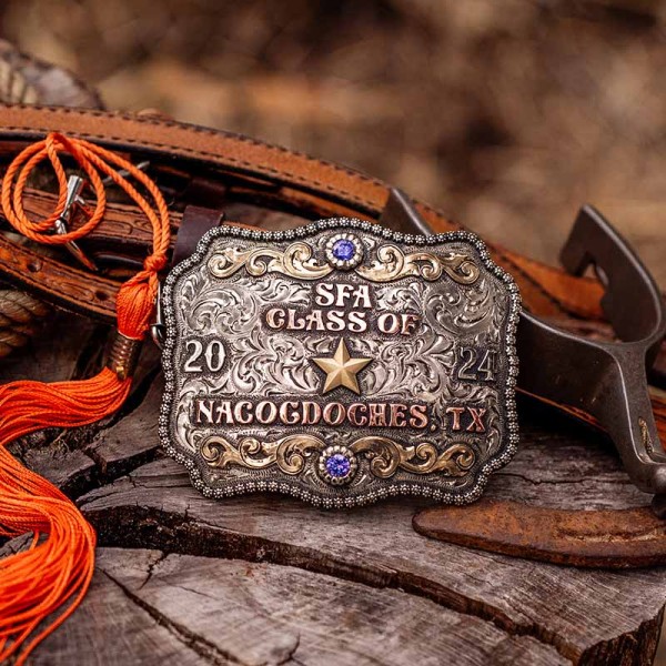 A custom western belt buckle for SFA Class of 2024 Nacocdoches, Texas, featuring a golden bronze star figure